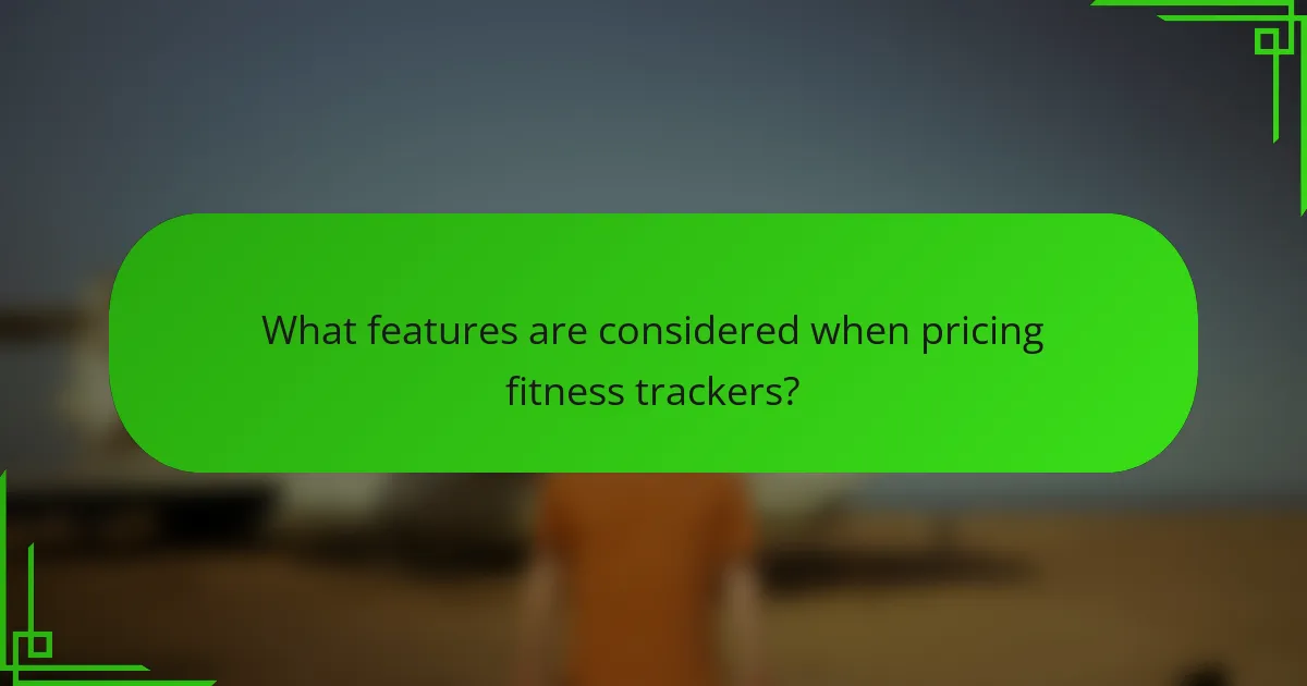 What features are considered when pricing fitness trackers?
